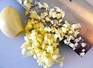 Chopped garlic ready for squeezing to extra the juice which has powerful anti-fungal properties